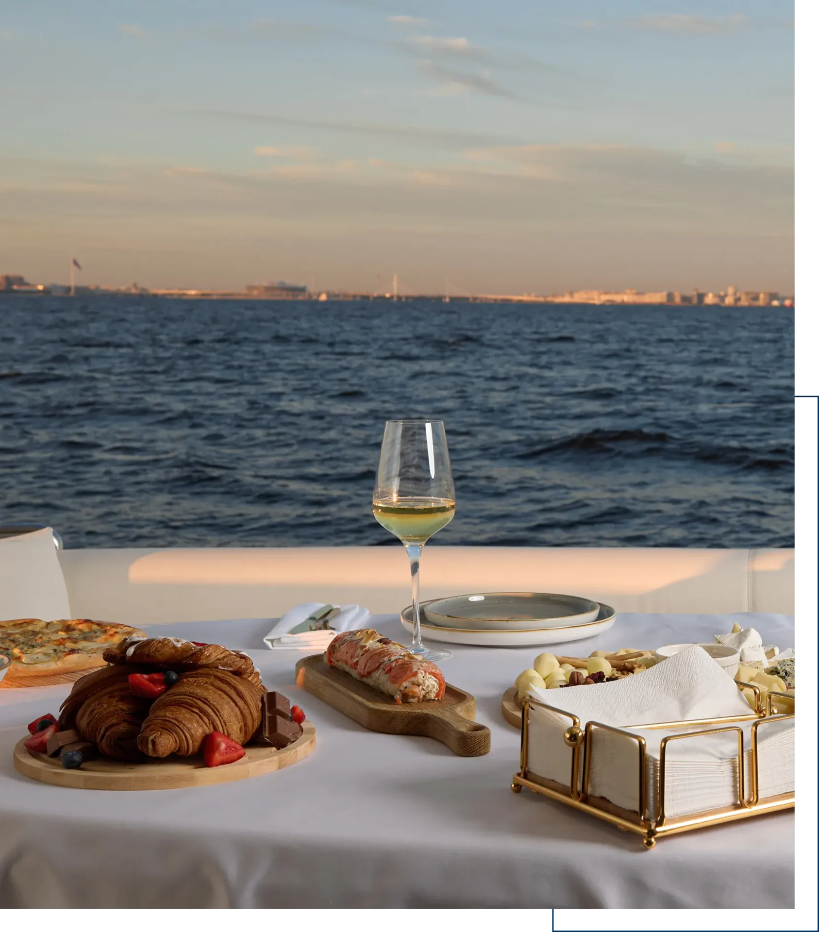 Oceanfront dining with pastries and wine