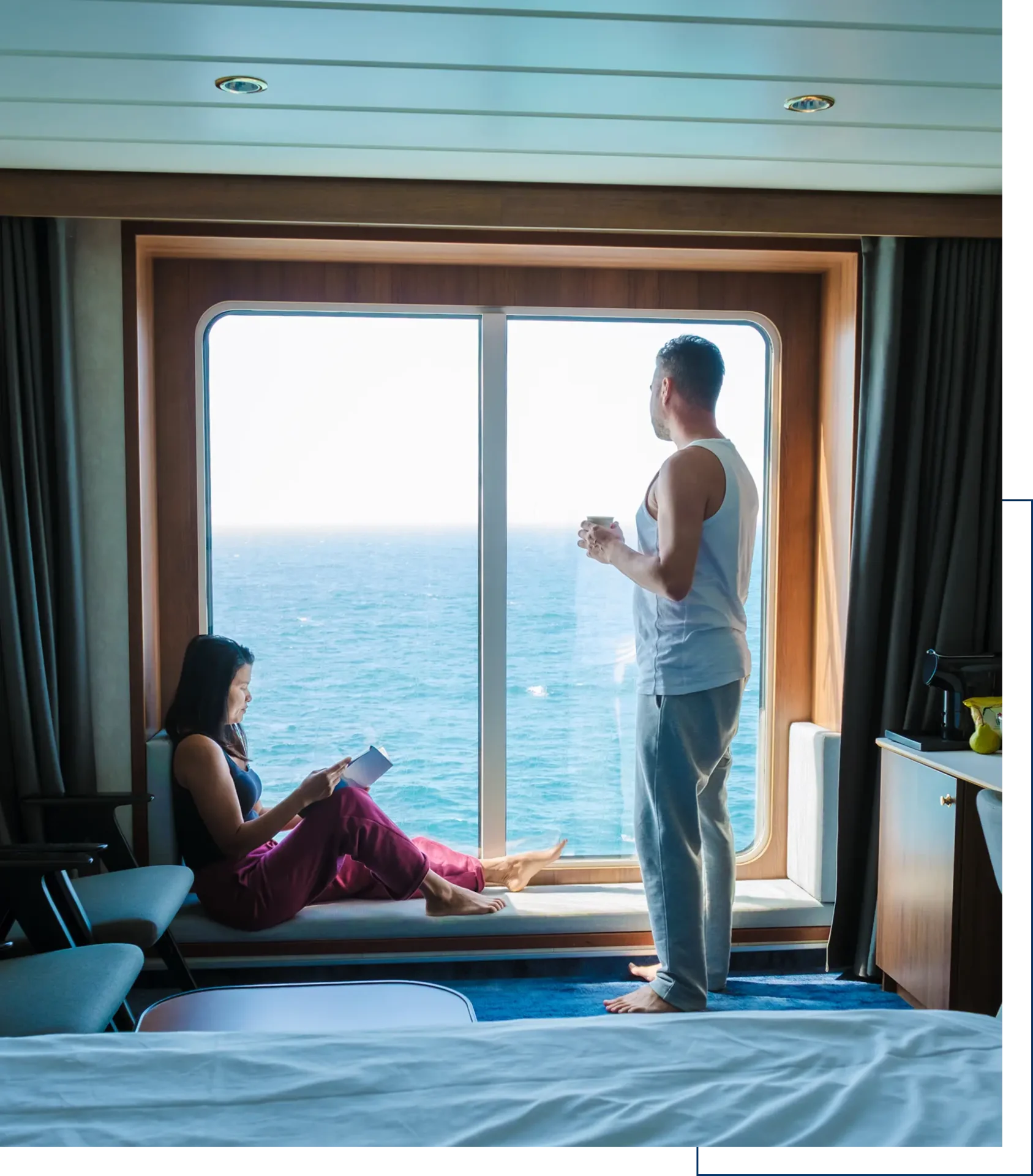 Couple enjoying ocean view from cabin