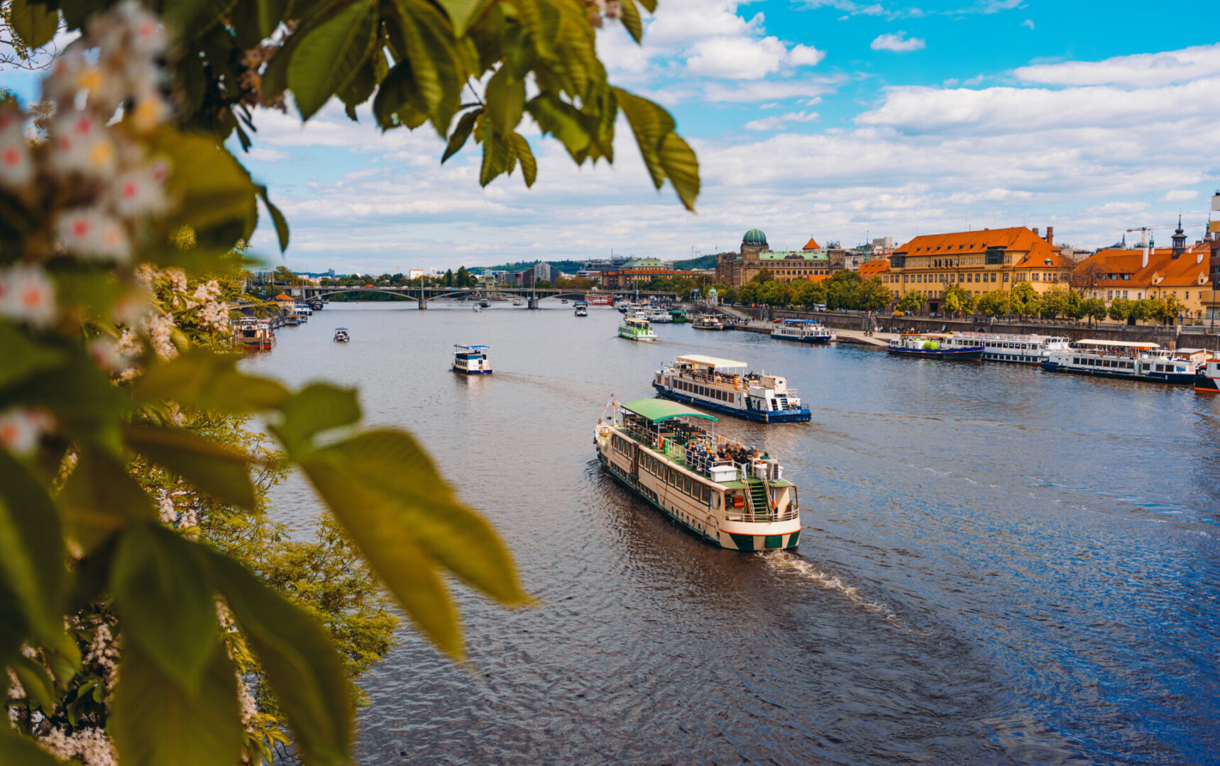 Boats navigating a picturesque river scene